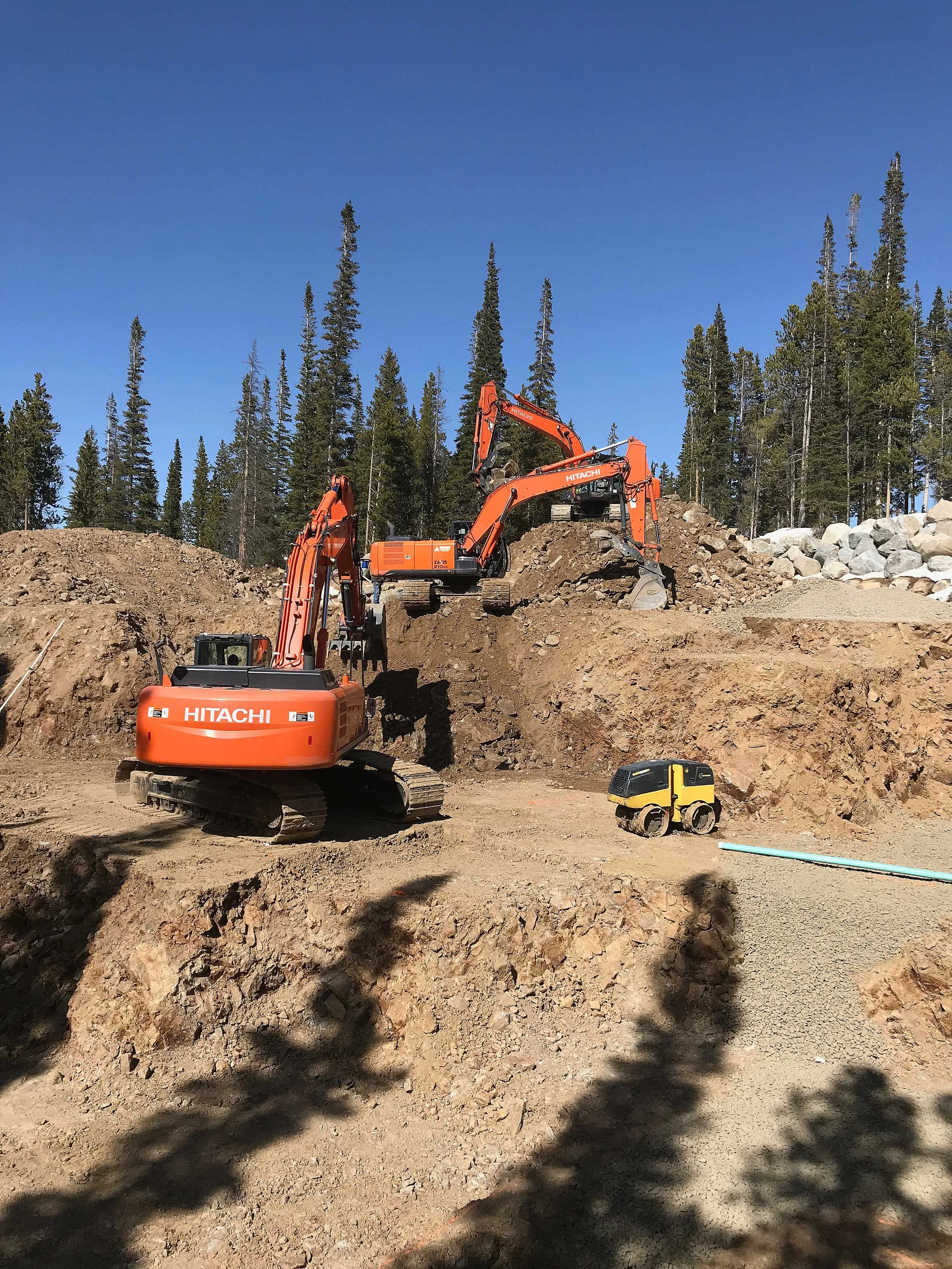 Excavators Trenching To Riprap