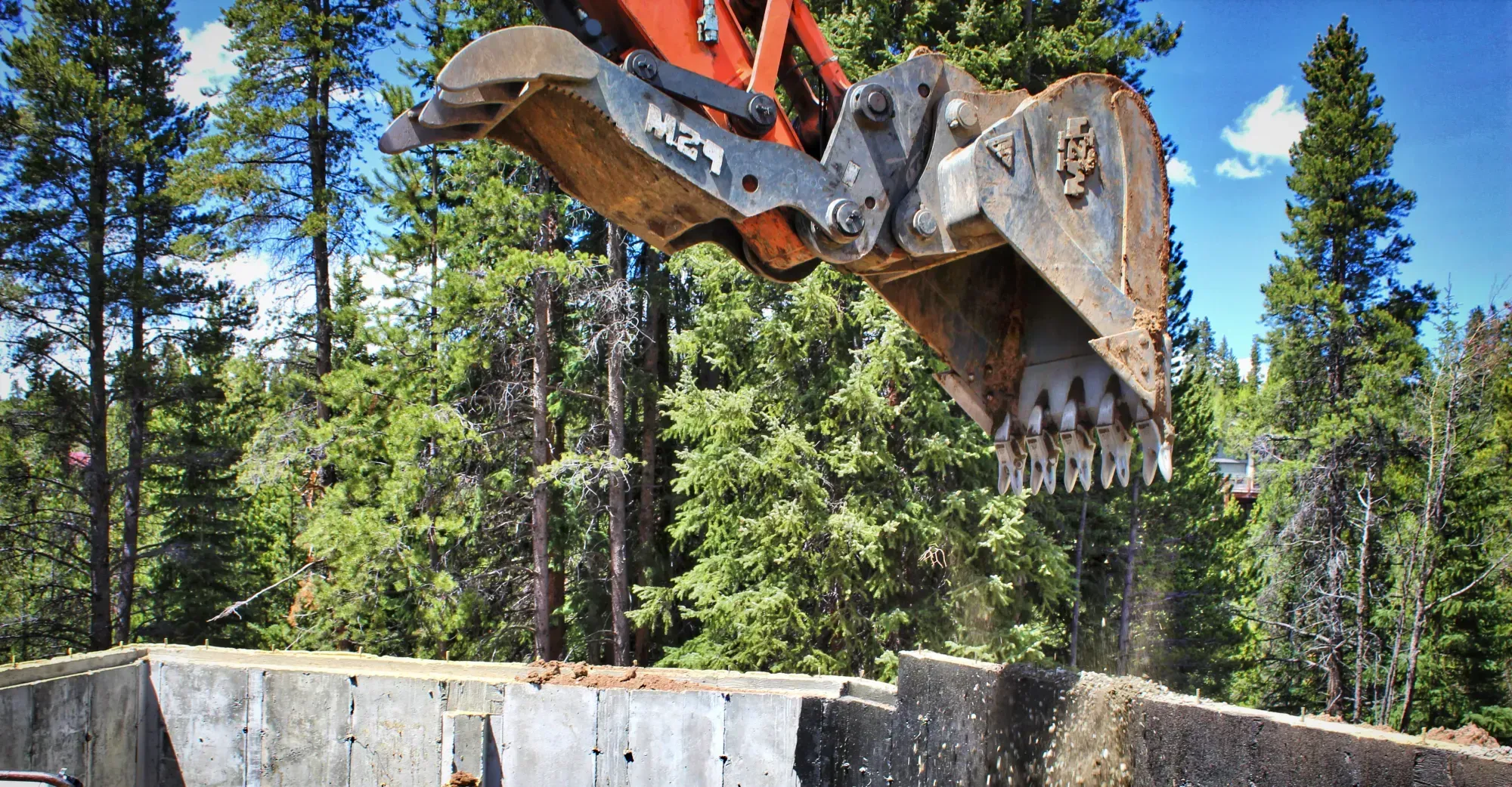 Alpine Earthworks excavator working a mountain site